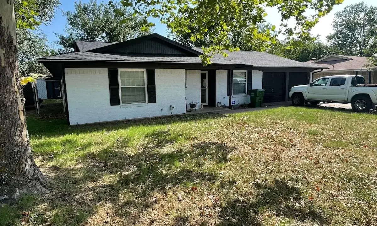 Professional roofing crew working on a residential roof in Bulverde